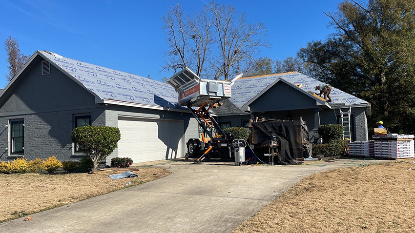 the Josh Neal team installing a new roof on a residential property